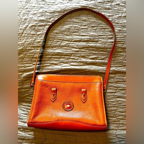 Dooney & Bourke Handbags - Vintage Dooney and Bourke pebble British Tan vachetta leather satchel bag.